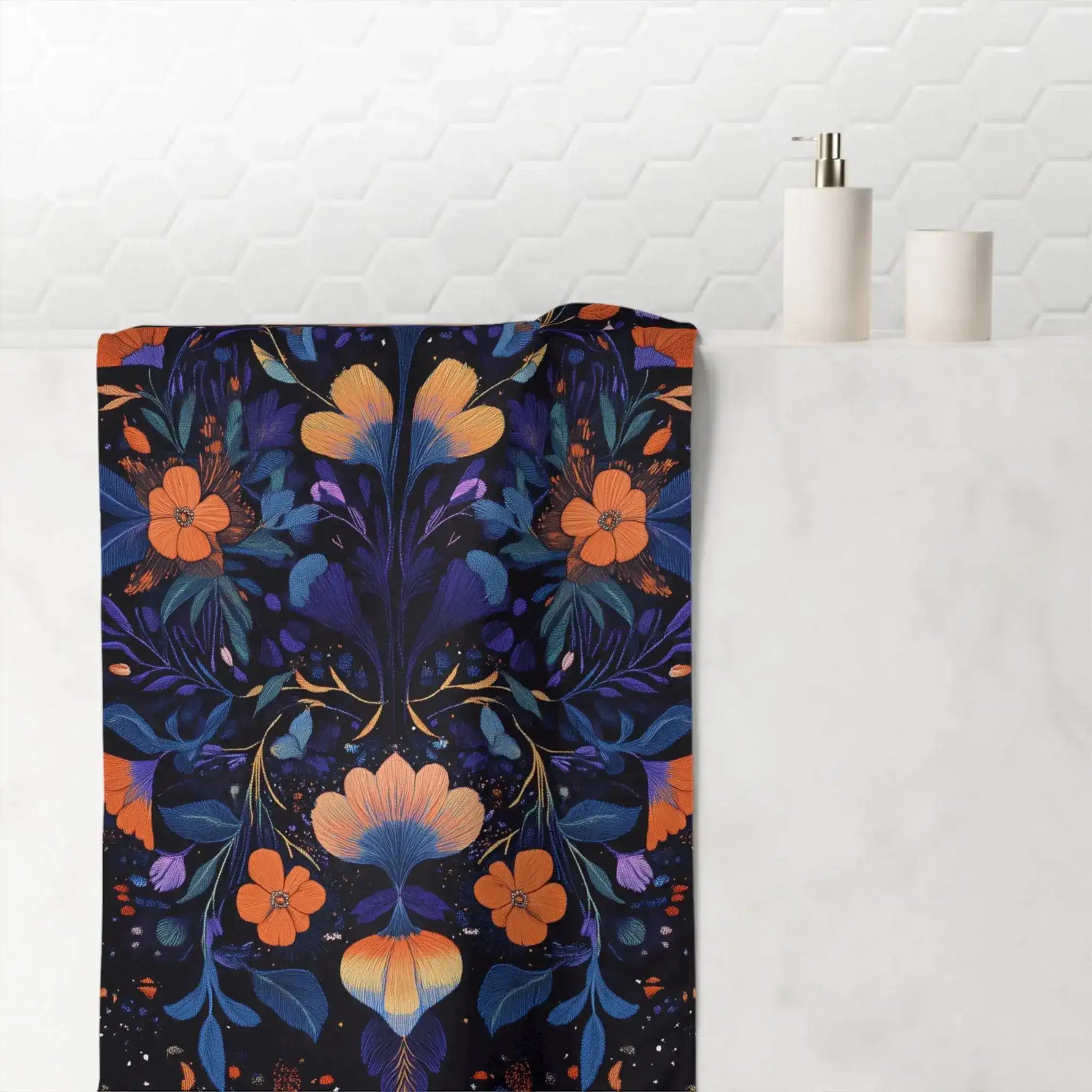 Dark navy bath towel bold orange and purple embroidery floral symmetrical botanical print hanging in bathroom