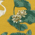 Close-up of a floral rug pattern with green leaves and white flowers on a yellow background