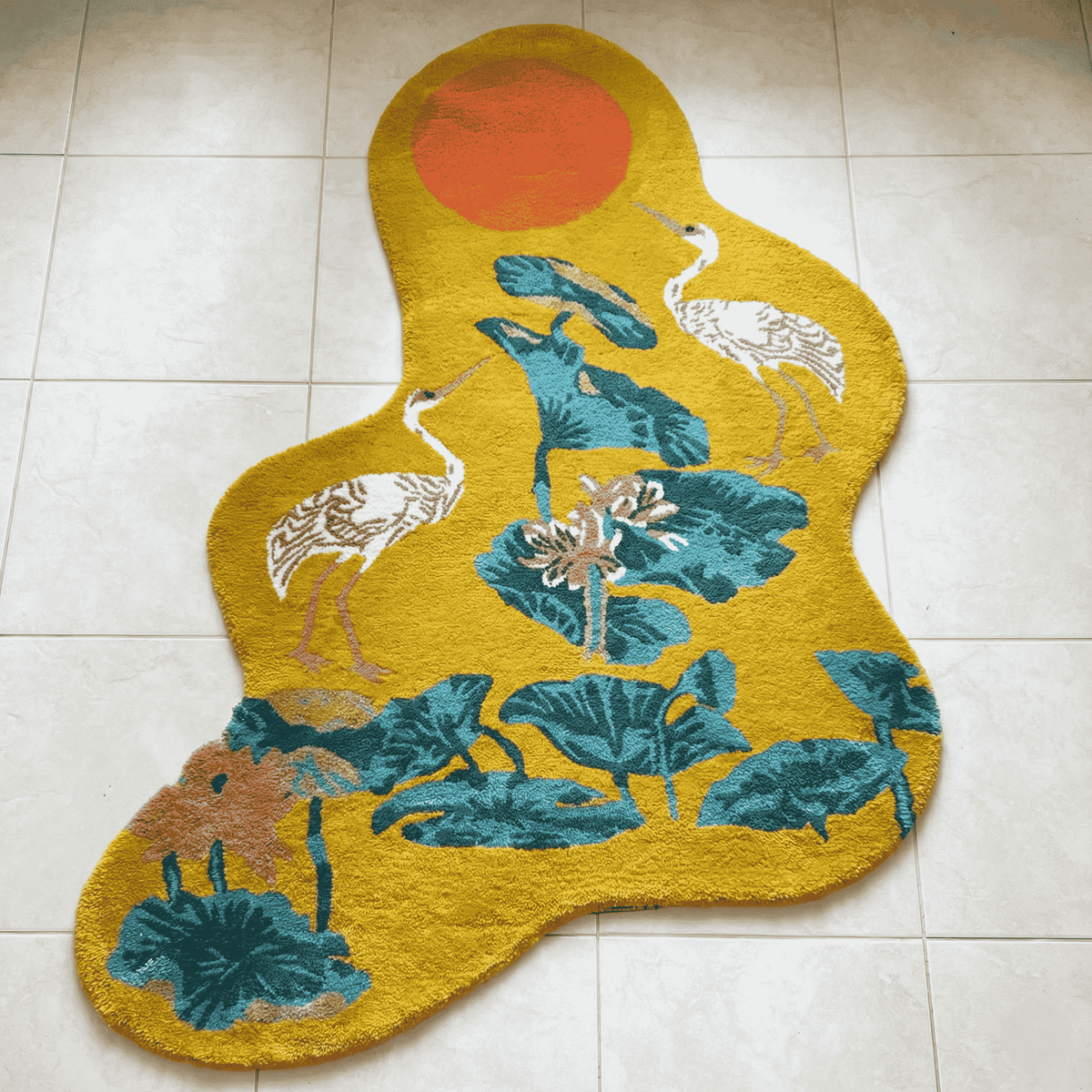 Decorative rug with nature-themed design on a tiled floor