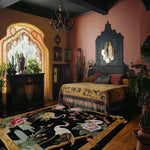cranes in floral harmony hand tufted rug in an eclectic pink bedroom with ornate carved headboard and Moorish arch