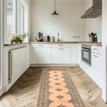 Elegant cream Javarak wool hand-knotted area rug runner in a modern kitchen setting. Perfect for those seeking area rugs for living room spaces, this exquisite living room area rug adds warmth and style to the hardwood floor.