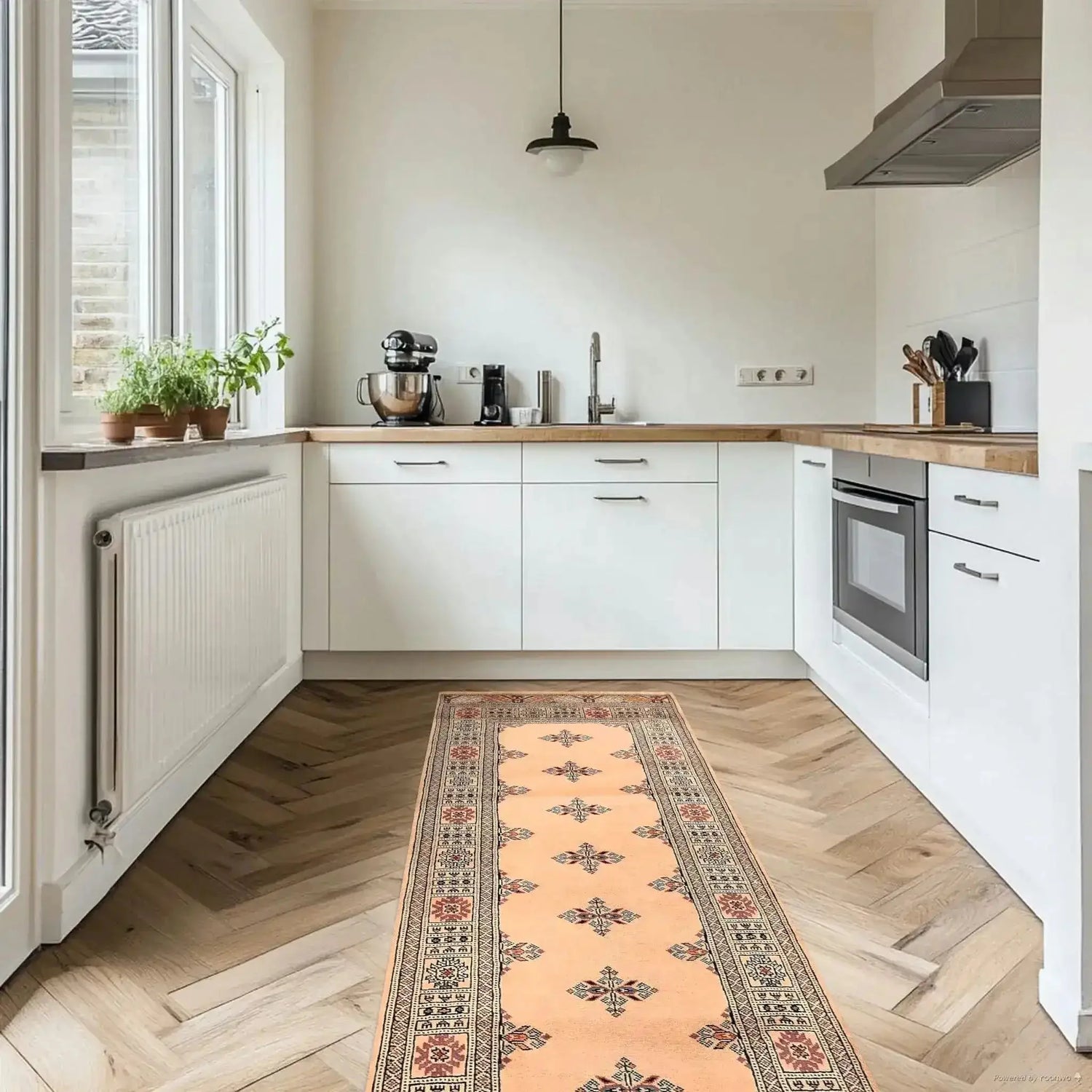 Elegant cream Javarak wool hand-knotted area rug runner in a modern kitchen setting. Perfect for those seeking area rugs for living room spaces, this exquisite living room area rug adds warmth and style to the hardwood floor.