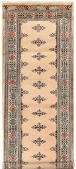 A beautifully detailed Cream Javarak Wool Hand Knotted Area Rug Runner featuring intricate geometric patterns and a rich border design. The rug showcases a warm cream color with subtle accents, perfect for adding elegance to any hallway or narrow space.