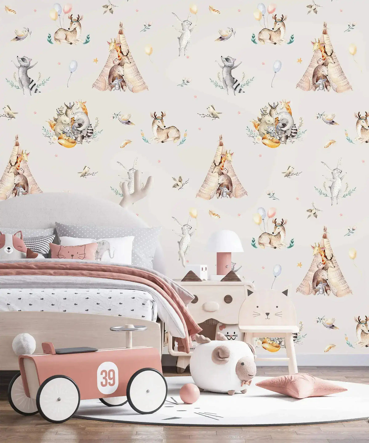 Cream kids wallpaper with woodland animals and teepees in bedroom with toy car and cat chair