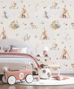 Cream kids wallpaper with woodland animals and teepees in bedroom with toy car and cat chair