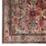Top view of the Crimson Bloom Hand Tufted Wool Area Rug featuring a vibrant floral pattern in shades of red and pink, bordered by intricate designs, perfect for adding elegance to any room.