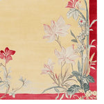 This area rug features an elegant floral design with soft red and cream tones, perfect for adding a touch of sophistication to your living room. Made from high-quality wool, this large living room rug combines durability with style.