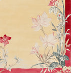 This area rug features an elegant floral design with soft red and cream tones, perfect for adding a touch of sophistication to your living room. Made from high-quality wool, this large living room rug combines durability with style.