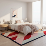 Modern bedroom with a colorful geometric rug, bed, and side tables.