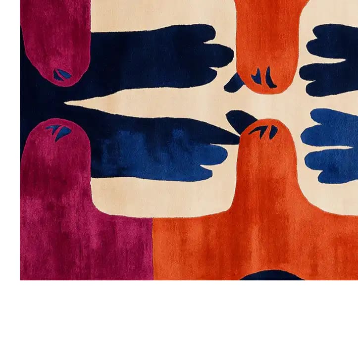 Vibrant hand-tufted wool area rug featuring an abstract design with bold colors like deep maroon, navy blue, and orange. The pattern resembles claws converging on a cream background, creating a striking visual impact.