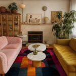 A beautifully styled living room featuring a Crimson Curve Hand Tufted Wool Rug, perfect for large living rooms. The vibrant area rug, in shades of crimson, orange, and navy, adds a touch of elegance to the cozy space, complemented by plush sofas and chic decor. Ideal for an office or living room, this 8x10 wool rug enhances the room’s aesthetic with its bold design.