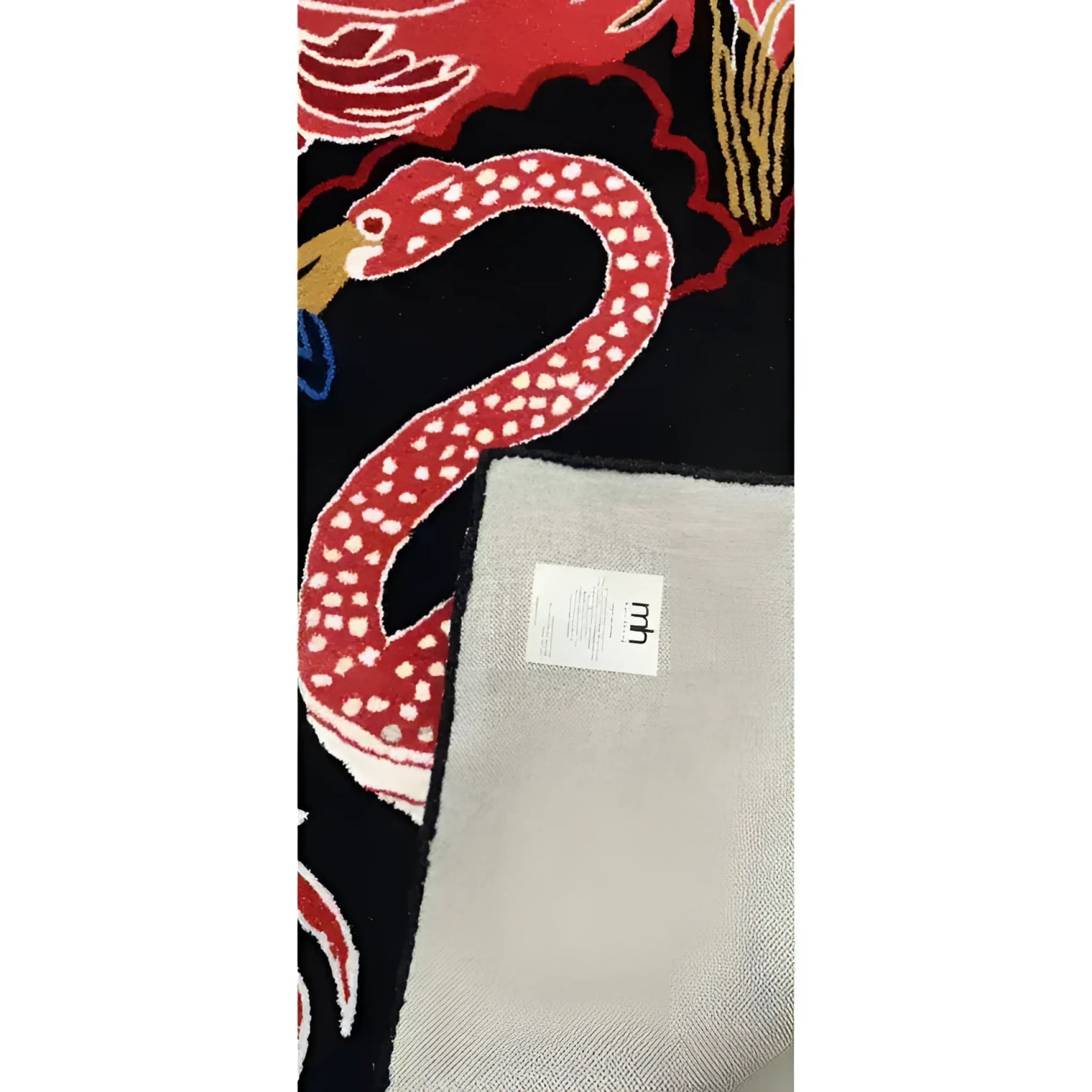 Close-up of the Crimson Paradise Hand Tufted Area Rug, featuring a vibrant red snake design on a black background, perfect for adding a bold touch to living room decor. This wool rug showcases intricate details, making it an ideal choice for those seeking unique living room area rugs.