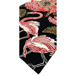 Vibrant Crimson Paradise hand-tufted area rug featuring an abstract design with pink flamingos and floral patterns, perfect for adding a touch of elegance to any living room. This wool rug offers a luxurious feel and a bold statement for living room area rugs.