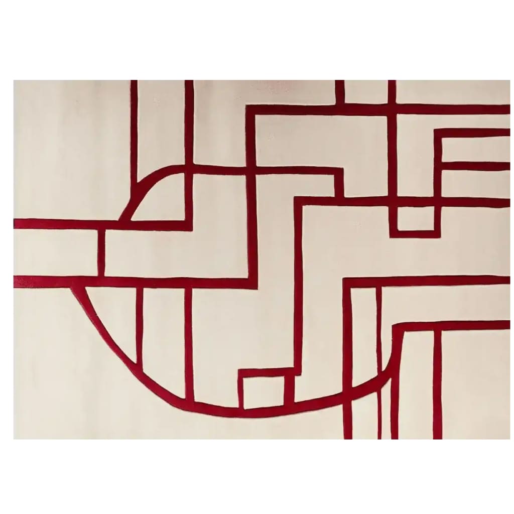 A top view of a contemporary area rug featuring a striking abstract design with bold crimson lines on a neutral background. Perfect for adding a modern touch to your living room, this wool rug offers both style and comfort.