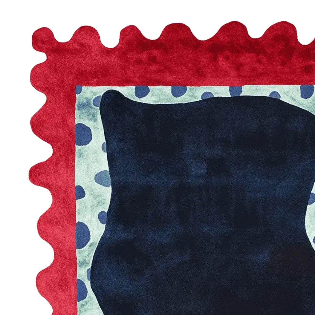 Close-up view of the Crimson Wave Pebbles Hand Tufted Area Rug, featuring bold red and navy abstract patterns with light blue polka dots, perfect as a contemporary wool rug for living rooms.