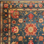 This intricately designed Cultural Blossom Legacy Hand Knotted Area Rug features a stunning floral pattern in vibrant red, blue, and gold hues. Perfect for adding a touch of vintage charm to your living room or dining room, this square area rug exemplifies the elegance of Persian rugs. Crafted from high-quality wool, it's an ideal choice for large living room rugs or as a dining table rug, offering both beauty and durability.