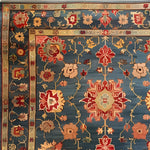 This intricately designed Cultural Blossom Legacy Hand Knotted Area Rug features a stunning floral pattern in vibrant red, blue, and gold hues. Perfect for adding a touch of vintage charm to your living room or dining room, this square area rug exemplifies the elegance of Persian rugs. Crafted from high-quality wool, it's an ideal choice for large living room rugs or as a dining table rug, offering both beauty and durability.
