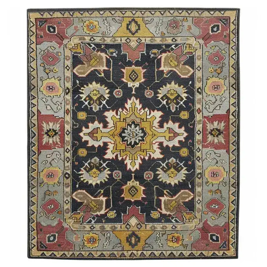Vibrant hand-tufted area rug featuring a rich mix of colors and intricate patterns, perfect for enhancing a living room or dining room. This wool rug showcases a traditional design that's ideal as a dining table rug centerpiece.