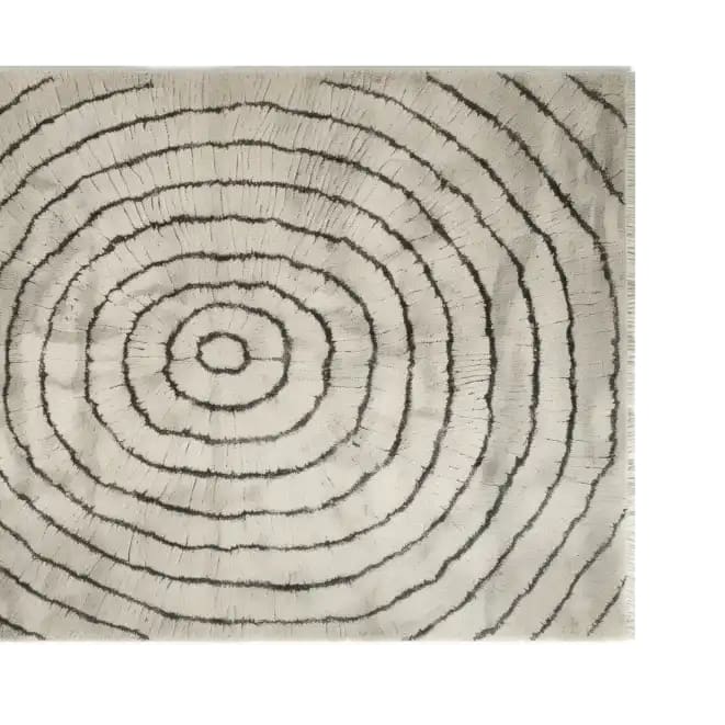 Top view of the Cyclic Whisper Knotted Wool Rug featuring a concentric circle pattern in neutral tones. This elegant area rug adds a modern touch to any space with its intricate design and soft texture.