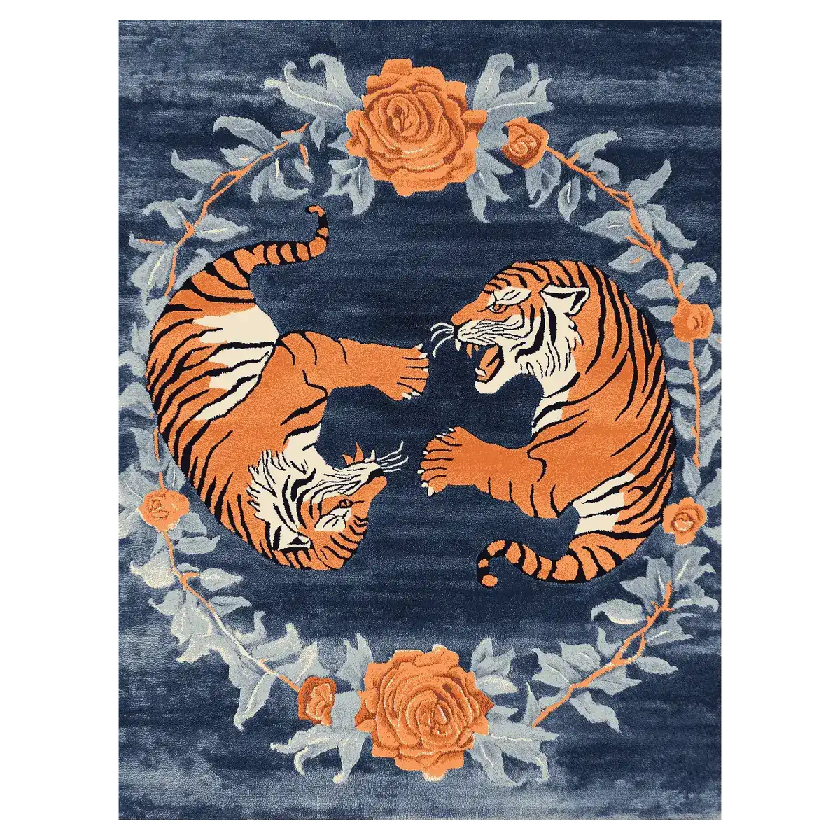 The 'Dance of the Wild Hand Tufted Rug' features an abstract design with two vibrant orange tigers encircled by intricate floral patterns on a deep blue background. Perfect as an area rug, it brings a touch of vintage charm to large living rooms, ideally sized at 8x10 feet. This wool rug combines elements of a floral rug with the boldness of a vintage rug, offering a unique centerpiece for your home decor.
