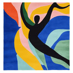 The Dancing Shadow Hand Tufted Rug is a stunning square area rug, ideal for large living rooms. It features a bold, contemporary design with a black silhouette of a dancer against a vibrant background of swirling colors including blue, orange, yellow, and pink. This wool rug adds a modern artistic touch to any living space, making it a perfect choice for those looking for unique rugs for the living room.