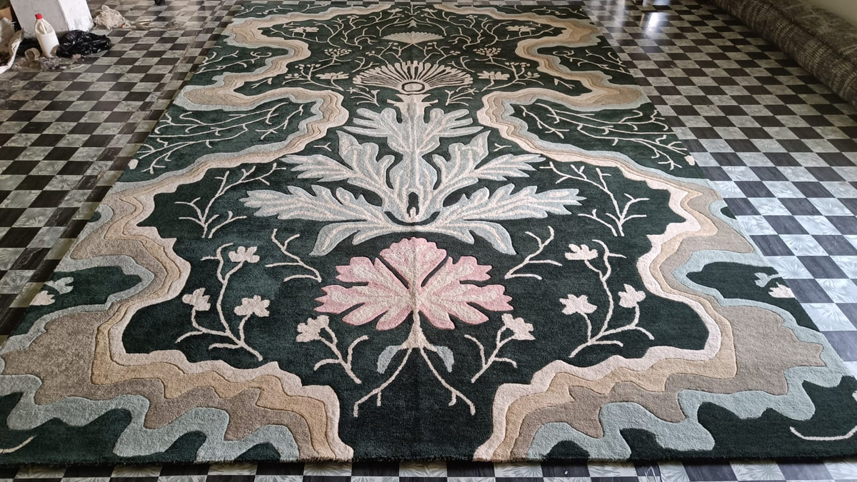 Dark green botanical rug with pink bloom and plush pile shown on a checkered tile floor
