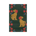 Dark green kitchen towel with two spotted leopards framed by red blossoms