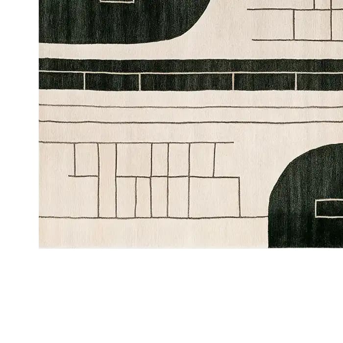 Top view of the Dark Wave Symphony Knotted Wool Area Rug featuring an abstract design with bold black and white geometric patterns. The intricate lines and contrasting colors create a modern and sophisticated look, perfect for enhancing any living space.