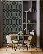 Deco geometric wallpaper with gold linked-oval lines on navy in a dining nook with a round wood table