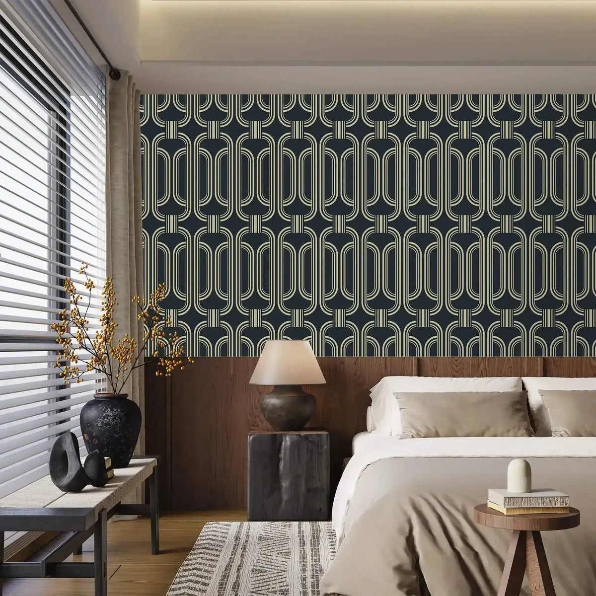 Deco geometric wallpaper with gold linked-oval lines on navy in a bedroom above a wood headboard and neutral bedding