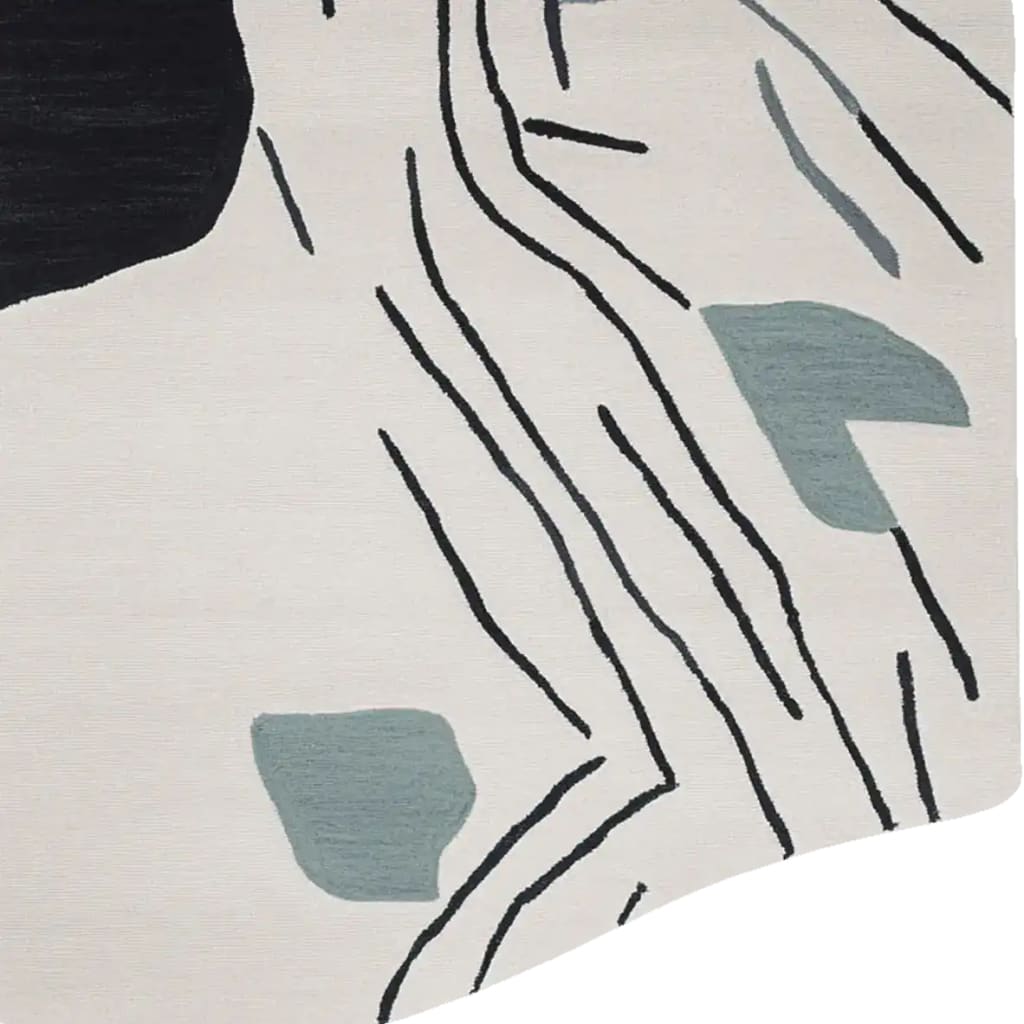 Close-up view of the Deco Line Clash Hand Tufted Rug, a contemporary area rug perfect for living room decoration. The wool rug features an abstract design with bold black lines and soft gray shapes against a cream background, ideal for modern interiors.