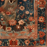 A detailed close-up of the Deer in the Meadow Hand Knotted Area Rug, featuring intricate floral patterns and a deer motif, perfect for adding a touch of elegance to any living room. This exquisite Persian rug design showcases vibrant colors and skilled craftsmanship, ideal for those seeking luxurious rugs for living room decor.
