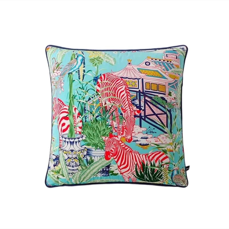 Colorful throw pillow featuring a vibrant aqua background with red and white zebra patterns, lush greenery, and a decorative garden scene.