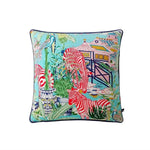 Colorful throw pillow featuring a vibrant aqua background with red and white zebra patterns, lush greenery, and a decorative garden scene.