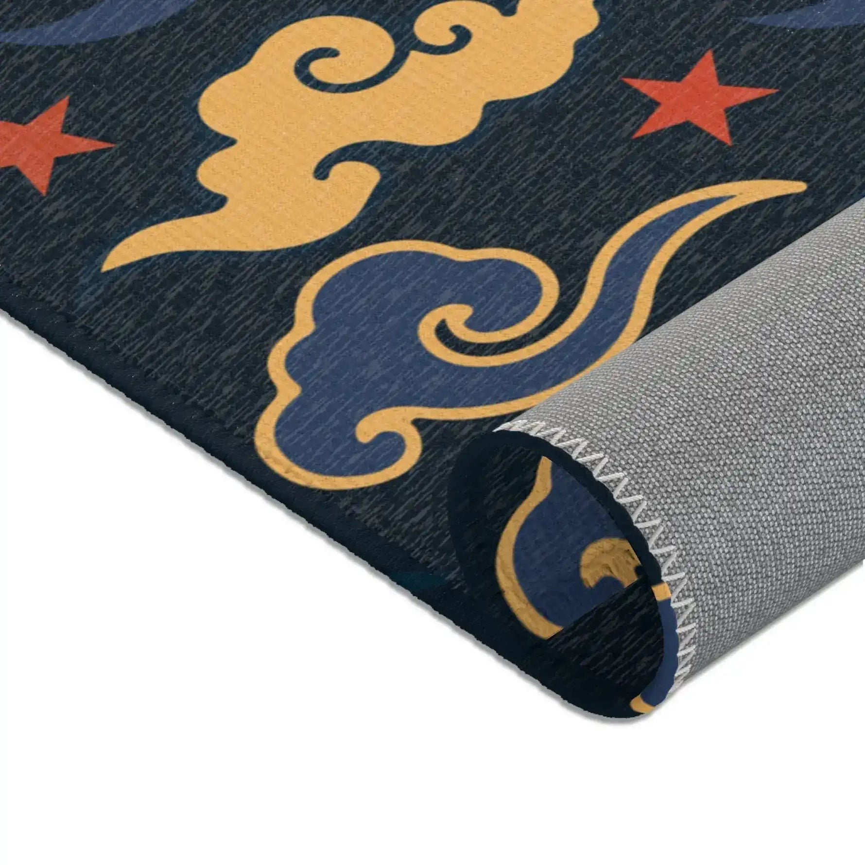 Detail of the Retro Night Sky Accent Rug, swirling gold and blue clouds on dark navy