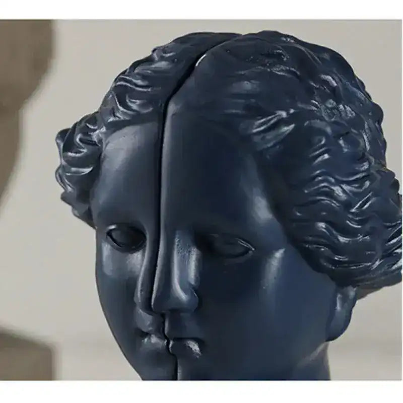 Navy blue split classical female goddess face close-up showing distinct hairline seam detail