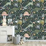 Dino Garden Oasis wallpaper in kids room with white chest of drawers, bunny lamp, gray felt storage baskets, and stuffed toys.