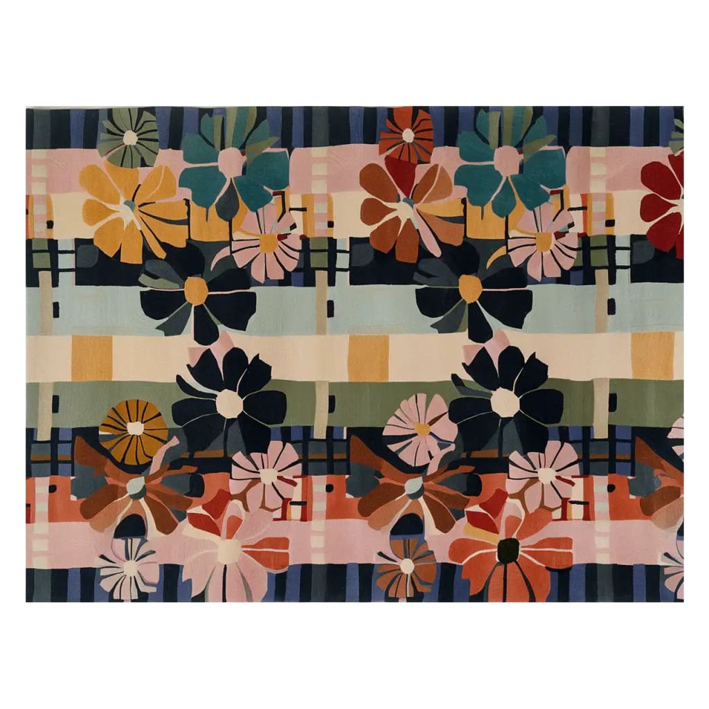 A vibrant, hand-tufted wool area rug featuring a colorful array of abstract flower designs in warm and cool tones. The Disco Daisies pattern showcases bold, graphic blooms set against a geometric backdrop, perfect for adding a playful touch to any room.