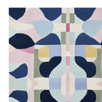 A vibrant, abstract area rug featuring a contemporary design with geometric shapes in shades of blue, pink, and yellow. This wool rug is perfect for adding a modern touch to large living room spaces.