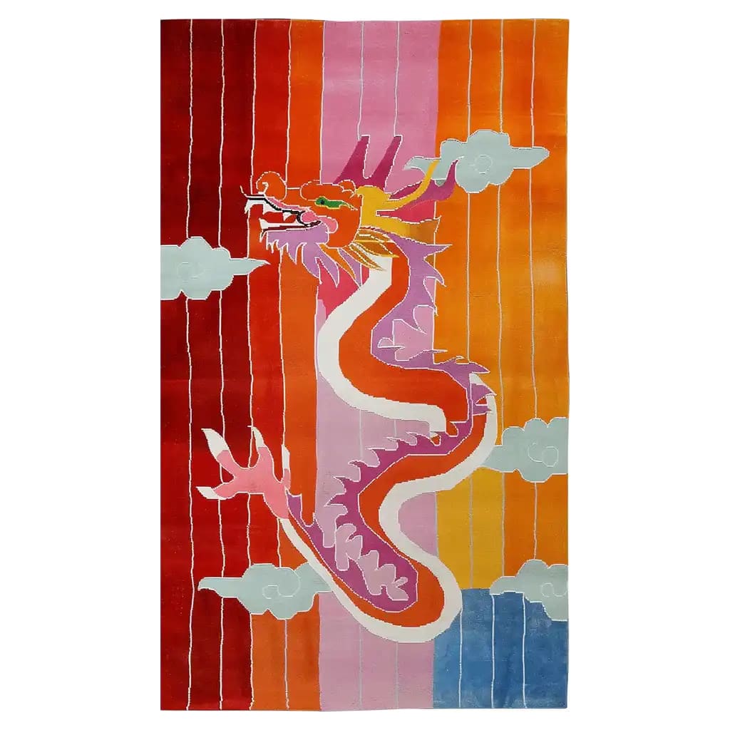 Vibrant hand-tufted wool area rug featuring a dynamic dragon design in bold colors of red, orange, pink, and blue, with cloud motifs. Perfect for adding an artistic flair to any room.