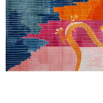 Vibrant Dragon Horizon Hand Tufted Wool Area Rug showcasing an abstract design with bold colors of blue, pink, and orange, featuring a stylized dragon motif in a top view.