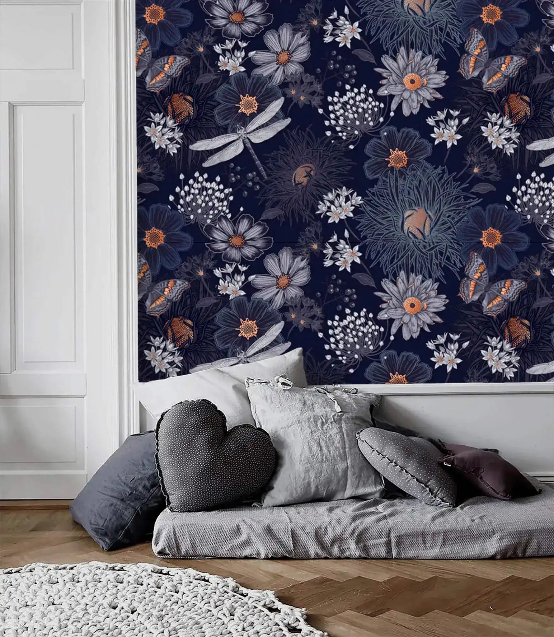 Dragonfly Ballet in Blossoms wallpaper above white wainscoting; grey floor cushions and heart pillow in casual sitting area