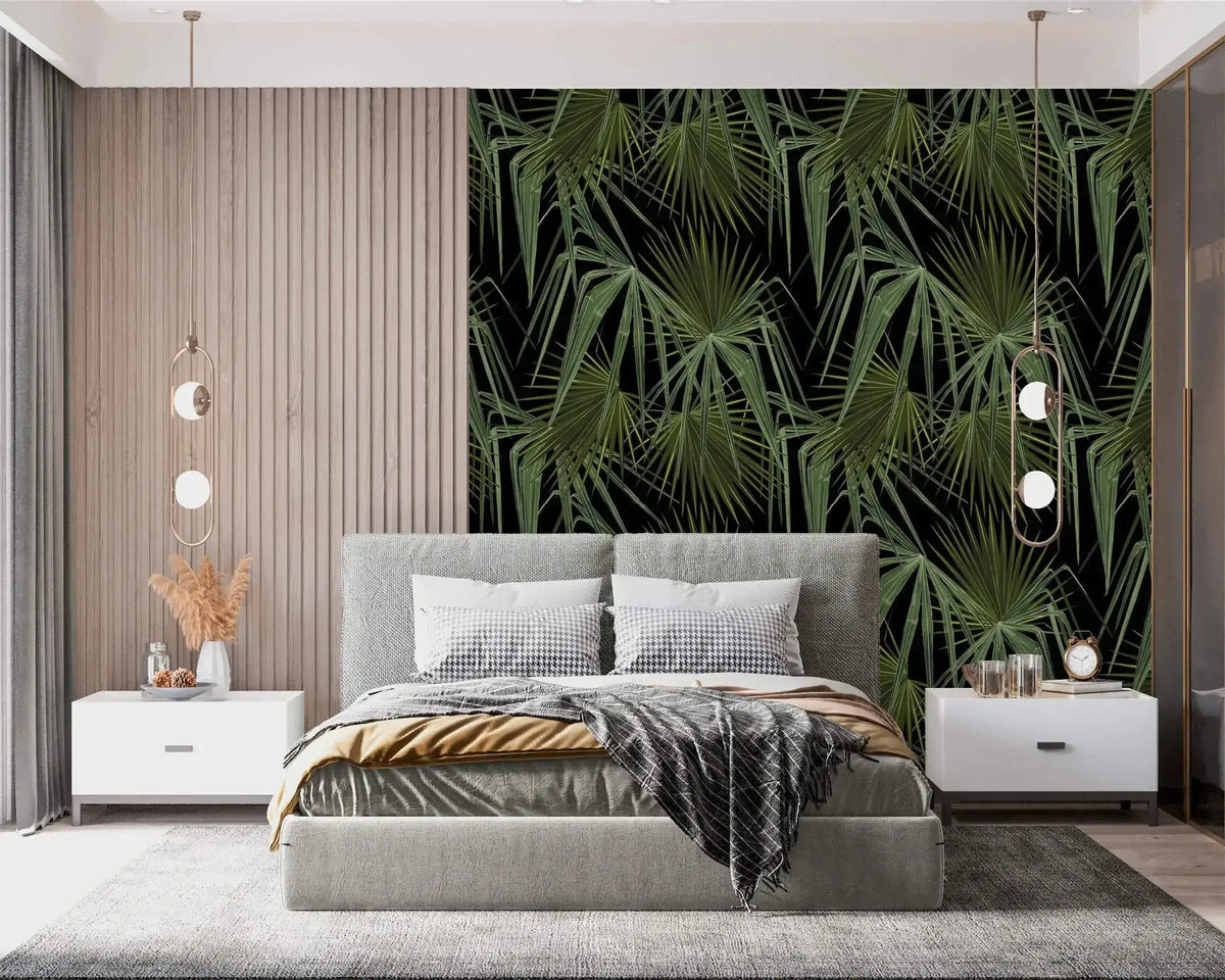 Green and black palm leaves wallpaper as headboard accent in modern bedroom with grey upholstered bed and white nightstands