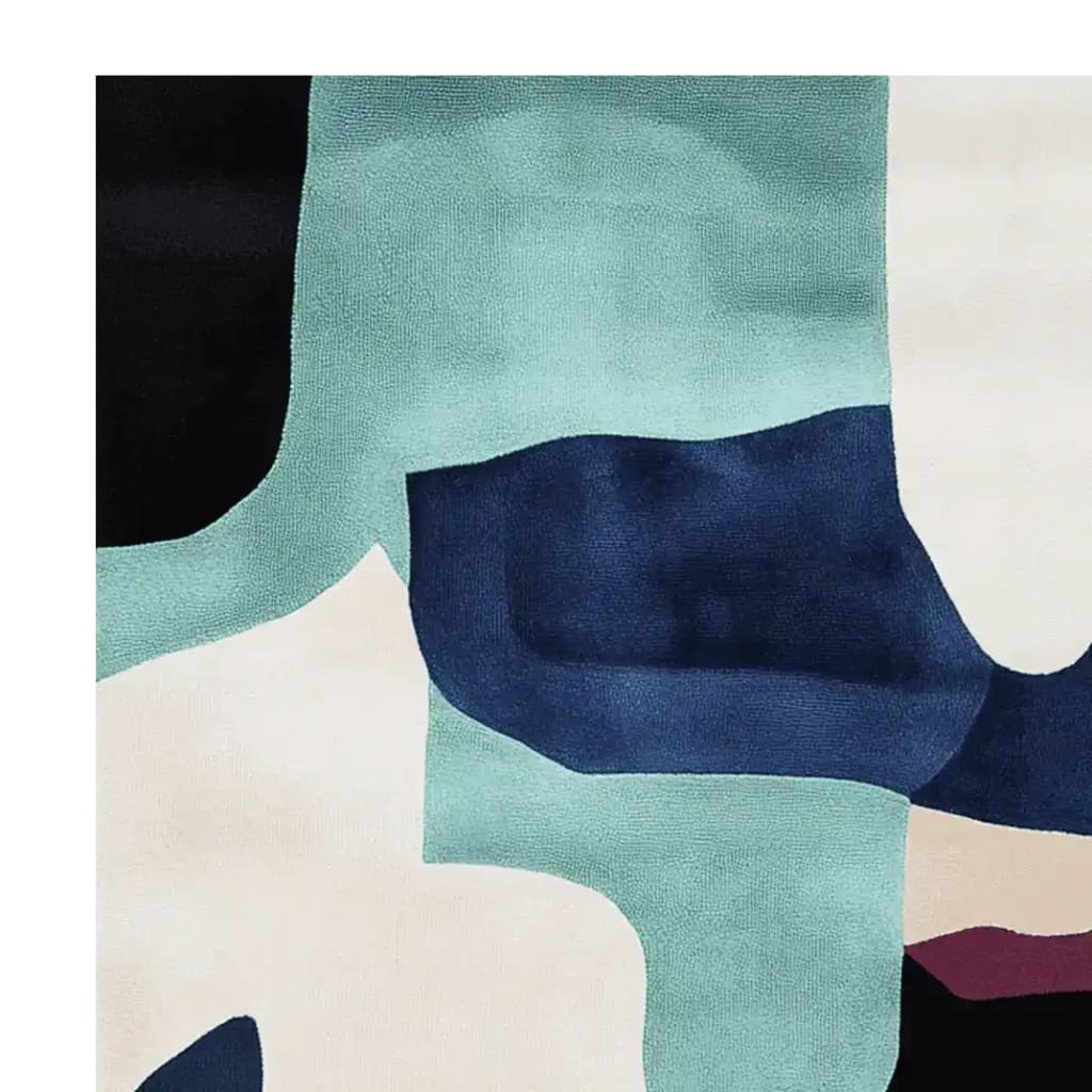 Close-up view of the Dream Coast Layers Hand Tufted Area Rug, showcasing its contemporary abstract design in shades of blue, white, and teal. This wool rug is perfect for adding a modern touch to living rooms, available in 8x10 size.