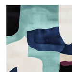 Close-up view of the Dream Coast Layers Hand Tufted Area Rug, showcasing its contemporary abstract design in shades of blue, white, and teal. This wool rug is perfect for adding a modern touch to living rooms, available in 8x10 size.