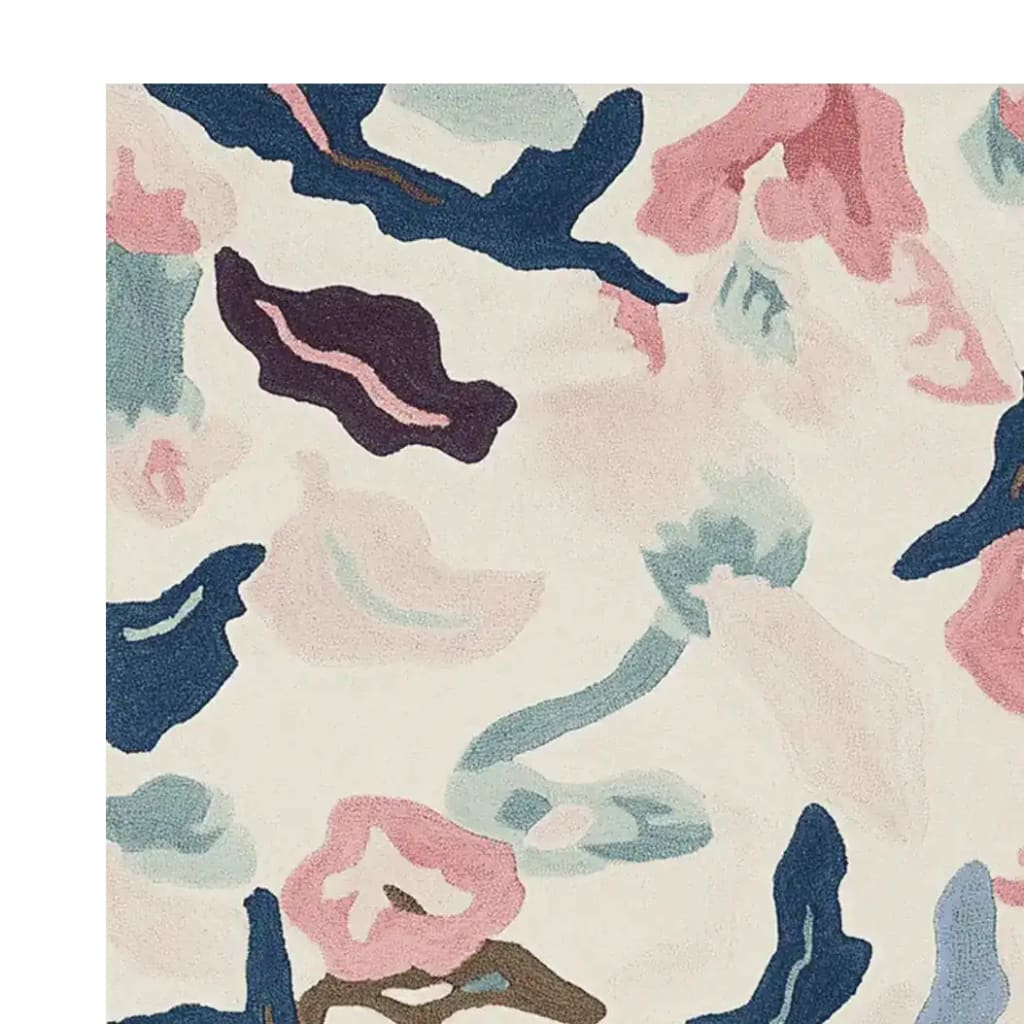 This image showcases a close-up view of the Dreamscape Mosaic Hand Tufted Area Rug, perfect for adding a touch of elegance to your living room. The contemporary rug features an abstract design with soft, blended colors including blue, pink, and cream, making it a stylish choice for living room rugs 8x10. Crafted from high-quality wool, this rug not only enhances the aesthetic appeal but also offers comfort and durability.