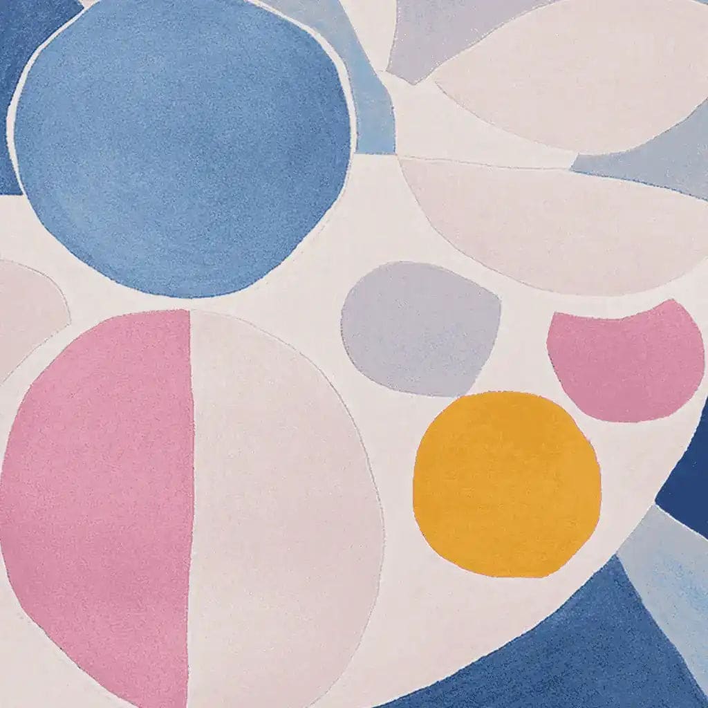A vibrant Dreamscape Patch Play hand-tufted area rug showcasing a contemporary design. This wool rug features an abstract pattern with large colorful circles in shades of blue, pink, yellow, and white, making it an ideal choice for large living room spaces. Perfect for adding a pop of color and modern flair to any living room area.