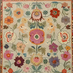 Dreamy Floral Hand Knotted Area Rug showcasing a vibrant and intricate floral pattern with an array of colorful flowers and leaves on a soft background, perfect for adding a touch of elegance to any room.