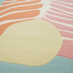 Close-up of a colorful rug with abstract patterns
