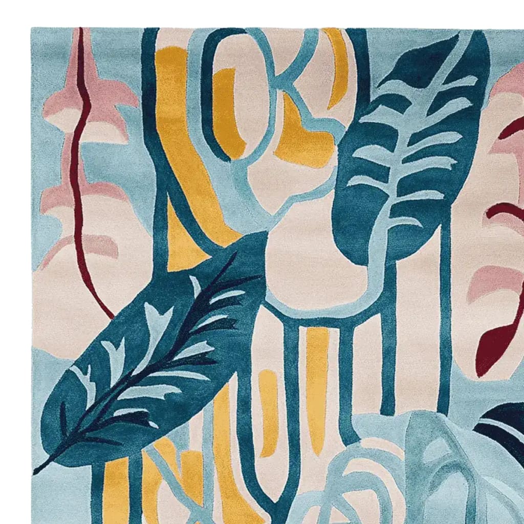 This image showcases a vibrant area rug, perfect for a contemporary living room. The wool rug features an abstract design with bold blue, yellow, and pink leaf patterns, making it an ideal centerpiece for large living room rugs. The Drift Leaf Riff Hand Tufted Rug adds a modern touch to any space, blending artistry with comfort for your living room area rugs collection.